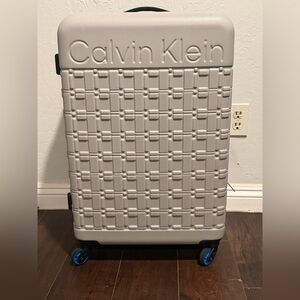Calvin Klein Textured Gray Luggage with Blue Accents